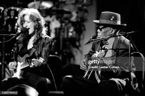 American blues singer, guitarist, songwriter, and activist Bonnie Raitt and American blues singer, songwriter, and guitarist John Lee Hooker sing and...