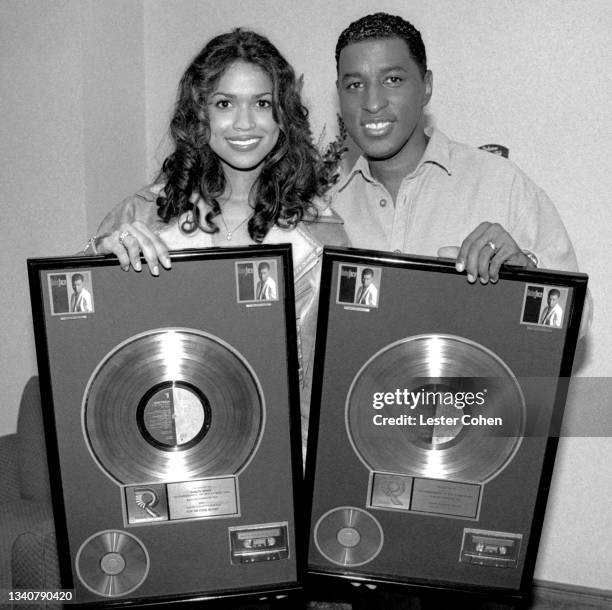 American businesswoman, television producer and personality Tracey Edmonds and husband American singer, songwriter, and record producer Babyface pose...