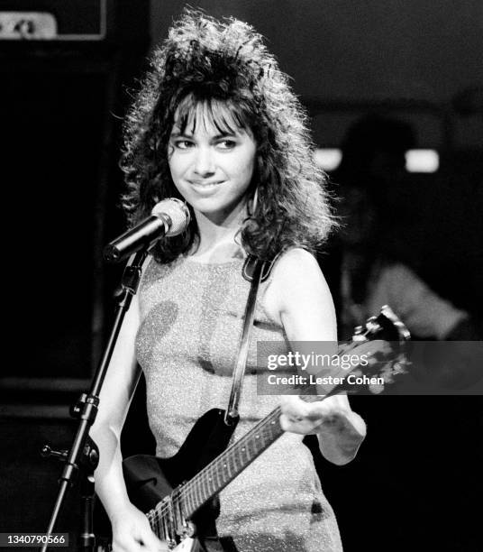 American singer-songwriter Susanna Hoffs, of the American pop rock band The Bangles, stands on stage during an appearance on American Bandstand on...