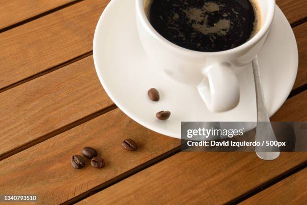 high angle view of coffee on table - broken coffee bean stock pictures, royalty-free photos & images