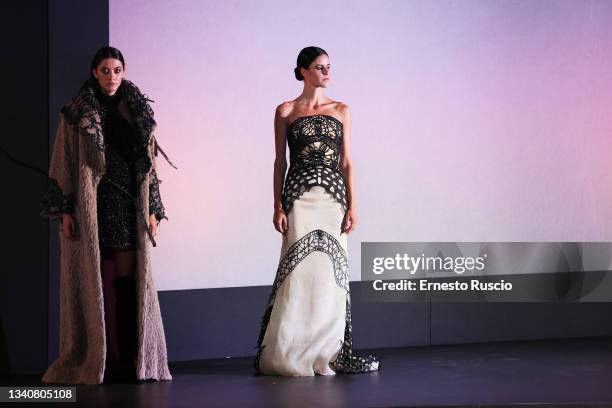 Models walk on the stage of "Roma è di Moda" show at Piazza Augusto imperatore on September 16, 2021 in Rome, Italy.