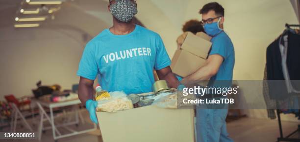 generosity & kindness - disaster preparation stock pictures, royalty-free photos & images