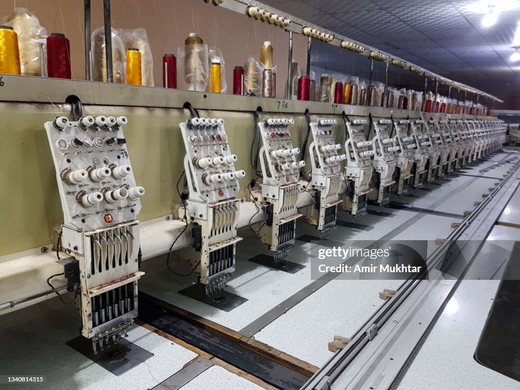 Closeup of fabric automatic embroidery machine parts.