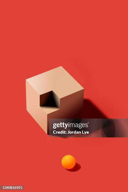 orange ball with incomplete wooden cube - mismatch stock-fotos und bilder