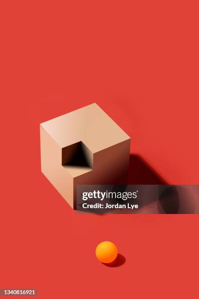 orange ball with incomplete wooden cube - mismatch fotografías e imágenes de stock