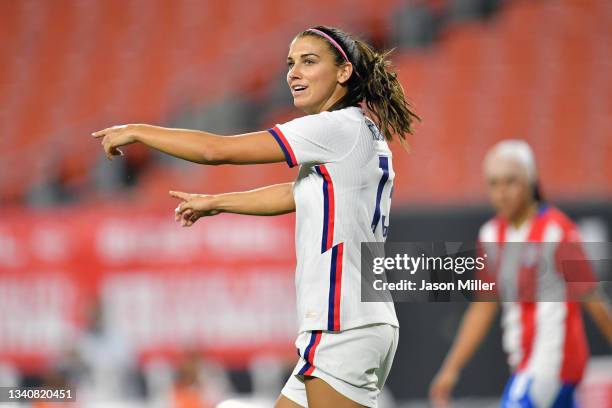 Forward Alex Morgan of Team United States talks to a teammate during the second half against Paraguay at FirstEnergy Stadium on September 16, 2021 in...