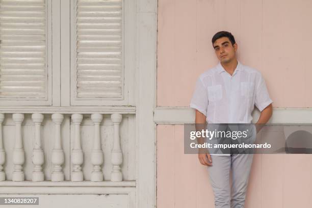 smily latin fit male portrait wearing casual clothes at guayaquil, ecuador, south america. - guayabera shirt stock pictures, royalty-free photos & images