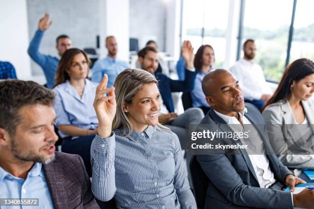 engaging seminar in board room! - hands raised business stock pictures, royalty-free photos & images