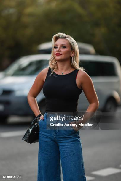 Evelyn Burdecki wearing a black top, a blue jeans and a black bag on September 14, 2021 in Berlin, Germany.