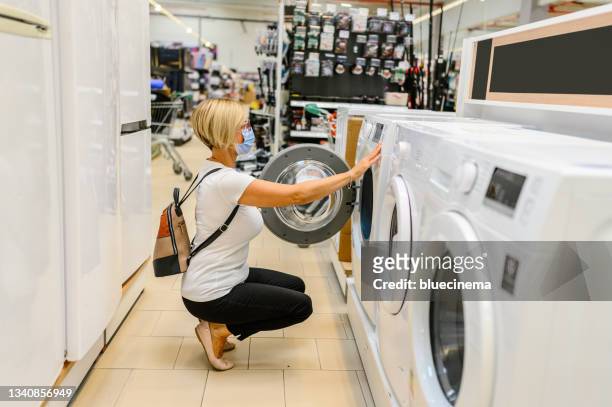 shopping for a washer and dryer - buying washing machine stock pictures, royalty-free photos & images