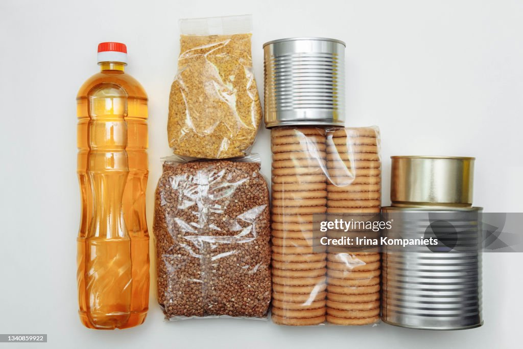 Food products in packages on white background.