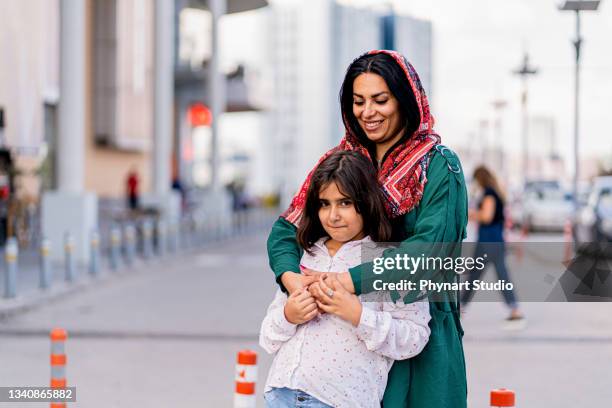 middle eastern mother and daughter - middle east stock pictures, royalty-free photos & images