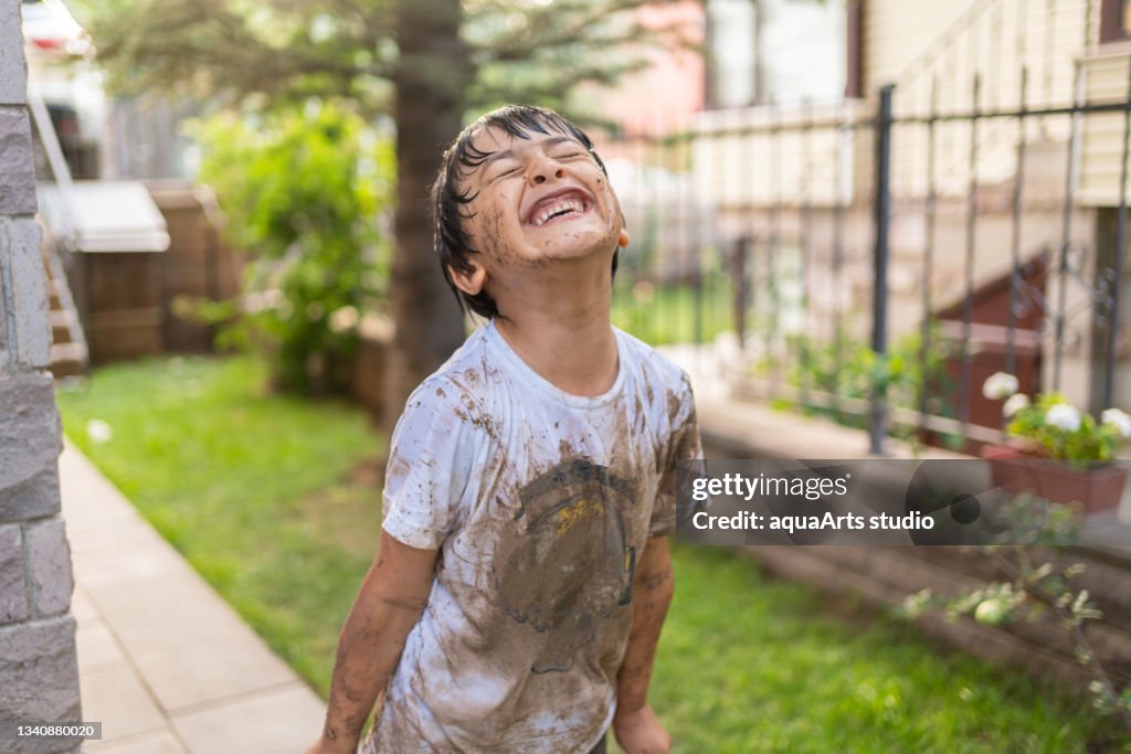Child With Dirty Clothes İn Mud