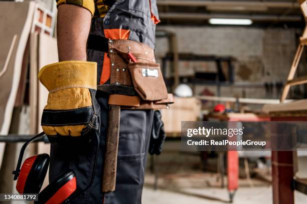 carpenter's yellow tool belt - trabajador manual stock pictures, royalty-free photos & images