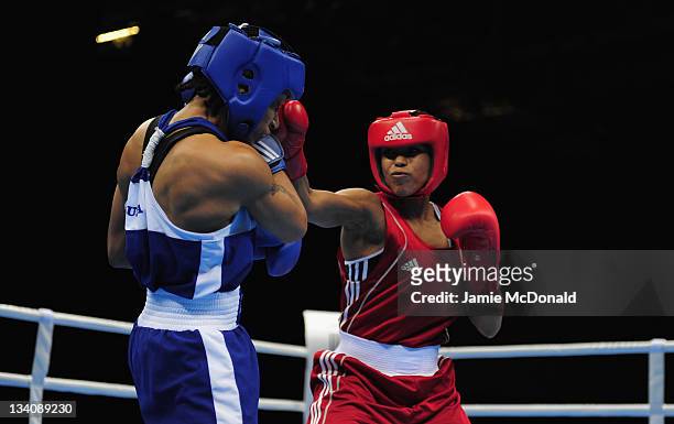 Natasha Jonas of Great Britain punches Quanitta Underwood of USA during their quaterfinal, 57kg-60kg bout at ExCel on November 25, 2011 in London,...