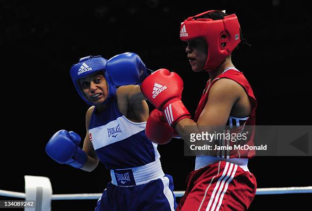 Quanitta Underwood of USA punches Natasha Jonas of Great Britain during their quaterfinal, 57kg-60kg bout at ExCel on November 25, 2011 in London,...