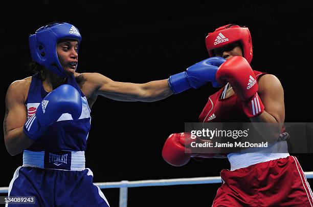 Quanitta Underwood of USA punches Natasha Jonas of Great Britain during their quaterfinal, 57kg-60kg bout at ExCel on November 25, 2011 in London,...