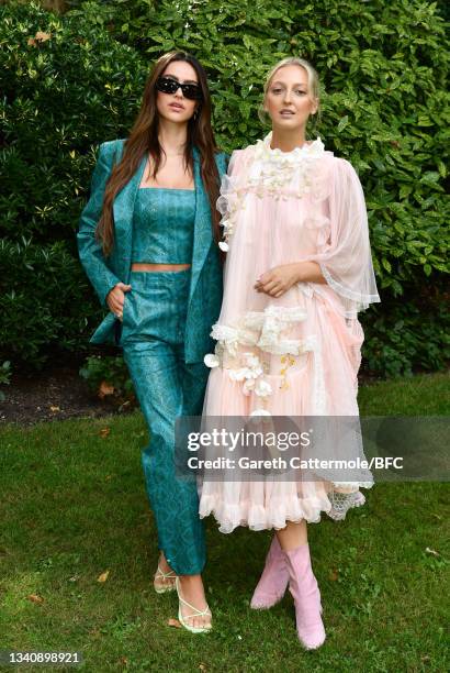 Amelia Gray Hamlin and Georgia Hirst attend the Bora Aksu show during London Fashion Week September 2021 on September 17, 2021 in London, England.