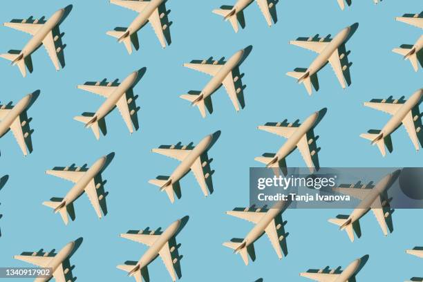 seamless pattern with toy airplane on blue background. creative travel concept - modellflygplan bildbanksfoton och bilder