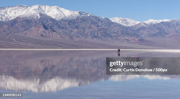 scenic view of lake and snowcapped mountains against sky,death valley national park,united states,usa - death valley national park stock pictures, royalty-free photos & images