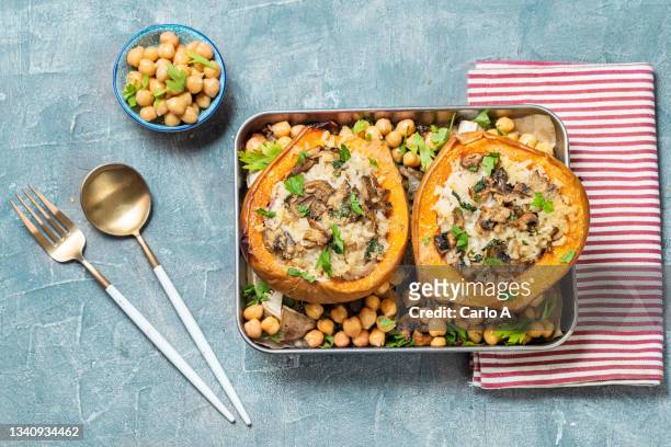 baked pumpkin stuffed with rice chickpea  mushrooms - stuffing photos et images de collection