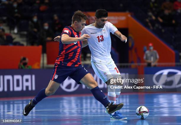 Farhad Tavakoli of IR Iran is challenged by Jeremy Klepal of USA during the FIFA Futsal World Cup 2021 group F match between IR Iran and USA at...