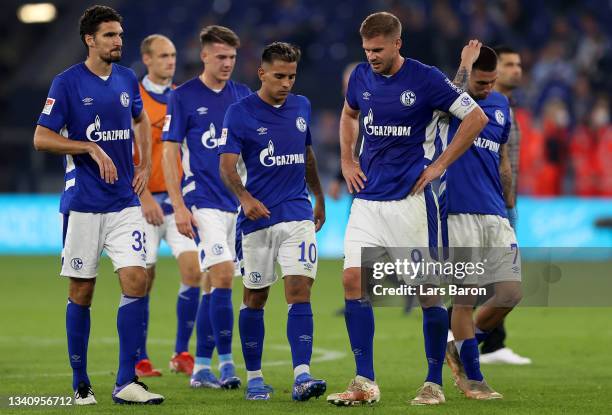 Simon Terodde of Schalke and his team mates are looking dejected after loosing the Second Bundesliga match between FC Schalke 04 and Karlsruher SC at...