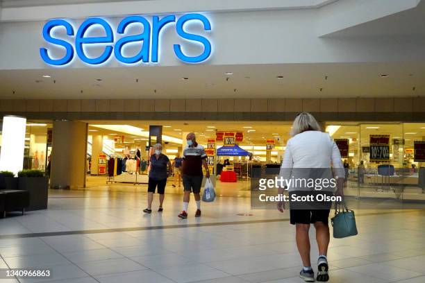 Customers shop at a Sears store in the Woodfield Mall on September 17, 2021 in Schaumburg, Illinois. The store, which will close it doors in...