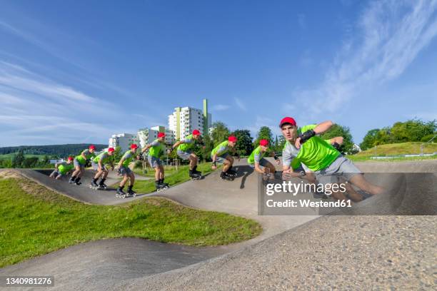 multiple image of young sportsman skating on pump track - skaten stockfoto's en -beelden