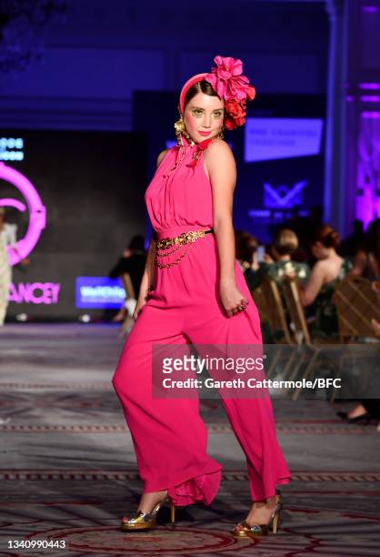 Gaia Wise walks the catwalk at The Icon Ball 2021 during London Fashion Week September 2021 at The Landmark Hotel on September 17, 2021 in London,...