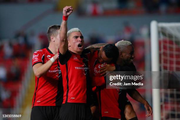 Julian Andres Quinones of Atlas celebrates with teammates after scoring his team's first goal during the 9th round match between Necaxa and Atlas as...