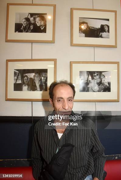 Hamid R&b Driver Parisian taxi driver Hamid poses with his portraits during his photo ...