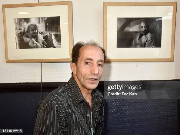 Hamid R&b Driver Parisian taxi driver Hamid poses with his portraits during his photo ...