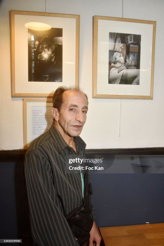 Hamid R&b Driver Parisian taxi driver Hamid poses with his portraits during his photo ...