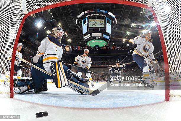 Goaltender Jhonas Enroth of the Buffalo Sabres looks back toward the net after Mark Letestu of the Columbus Blue Jackets buried a rebound for the...