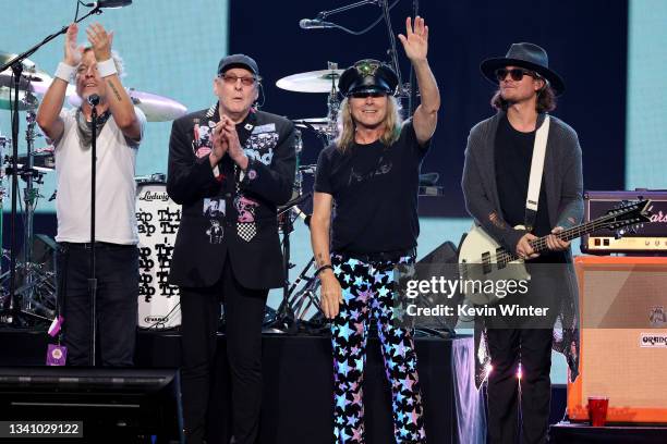 Daxx Nielsen, Rick Nielsen, Robin Zander, and Robin Zander Jr. Of Cheap Trick perform onstage during the 2021 iHeartRadio Music Festival on September...