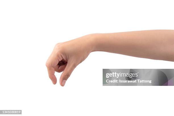 hand pick some like object isolated on a white background, manicured hand, concept the selection, pick up things - invisible man fotografías e imágenes de stock