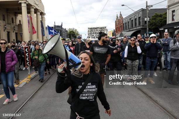 Anti lockdown protesters gather on Bridge Road in Richmond on September 18, 2021 in Melbourne, Australia. Anti-lockdown protesters gathered despite...