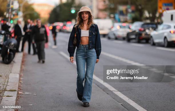 Julia HLM wearing a beige hat, jeans jacket, a Louis Vuitton bag and blue jeans on September 13, 2021 in Berlin, Germany.