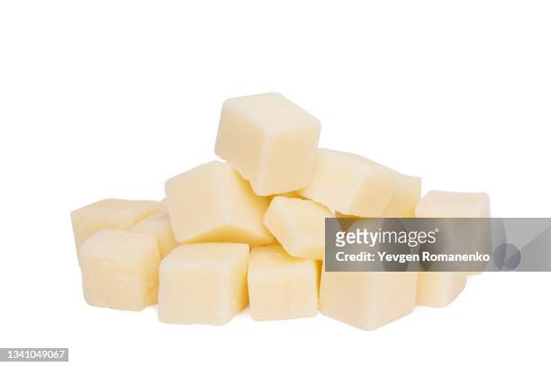cheese cubes isolated on white background - cheddar cheese stock pictures, royalty-free photos & images