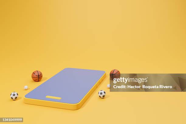 3d image of mobile phone with basketball and soccer balls on yellow isolated background, concept sport - smart phone 3d stock pictures, royalty-free photos & images