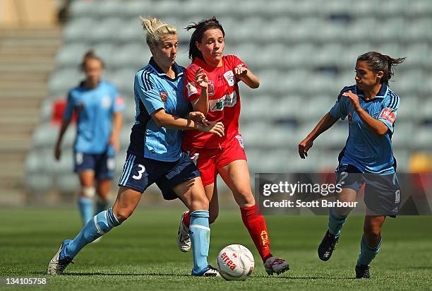 Donna Cockayne of United competes with Terasa Polias and Danielle Brogan of Sydney FC for the ball during the round six W-League match between...