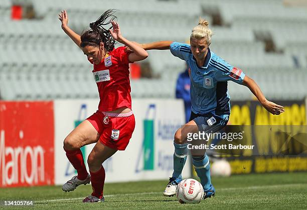 Donna Cockayne of United competes with Danielle Brogan of Sydney FC for the ball during the round six W-League match between Adelaide United and...