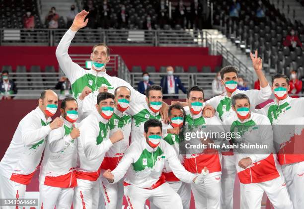 Gold medalist Team Iran celebrates on the podium at the medal ceremony for the Men's Sitting Volleyball on day 11 of the Tokyo 2020 Paralympic Games...