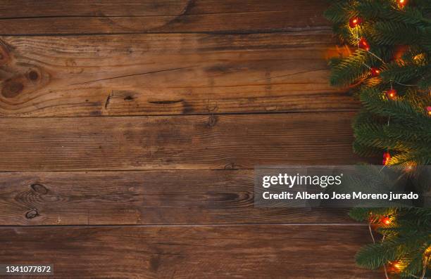 wooden background with branches of christmas tree. greeting card - draped table stock pictures, royalty-free photos & images