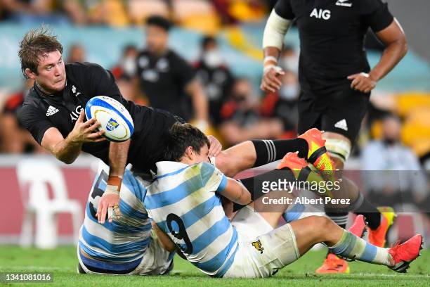 Ethan Blackadder of the All Blacks offloads the ball in a tackle during The Rugby Championship match between the Argentina Pumas and the New Zealand...