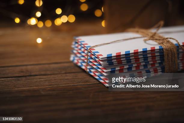 many cards on wooden background. getting card - correspondence imagens e fotografias de stock