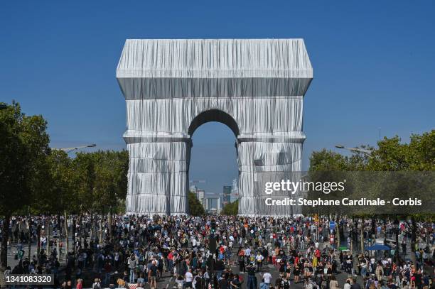 The Parisians come to see packaging of the Arc de Triomphe, posthumous work of Christo on September 18, 2021 in Paris, France.