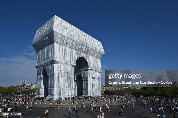 The Parisians come to see packaging of the Arc de Triomphe, posthumous work of Christo on September 18, 2021 in Paris, France.