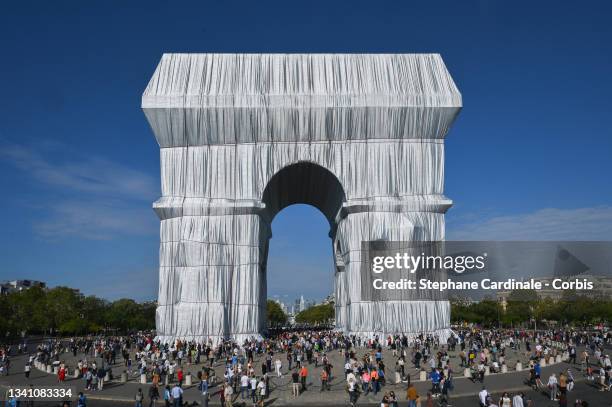 The Parisians come to see packaging of the Arc de Triomphe, posthumous work of Christo on September 18, 2021 in Paris, France.